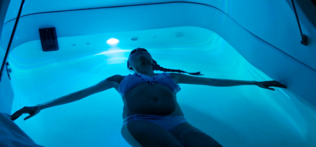Young woman in sensory deprivation tank