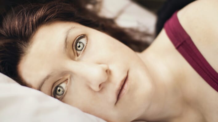 woman is sleep deprived green eyes