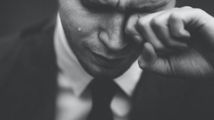 man cries black and white photo
